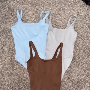 Elegant Women's Bodysuit Trio - Light Blue, Cream, and Brown